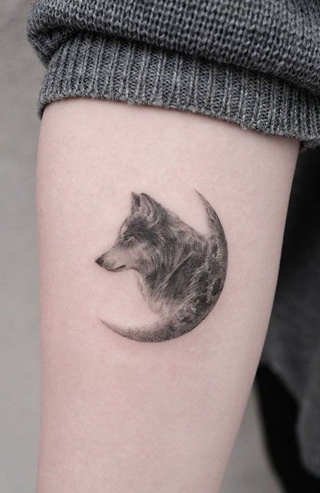 50 Best Wolf Tattoo Designs & Meaning for Men and Women Kurt Tattoo, Wolf Paw Tattoos, Simple Wolf Tattoo, Wolf Girl Tattoos, Wolf And Moon Tattoo, Lone Wolf Tattoo, Wolf Tattoos For Women, Luna Tattoo, Small Wolf Tattoo