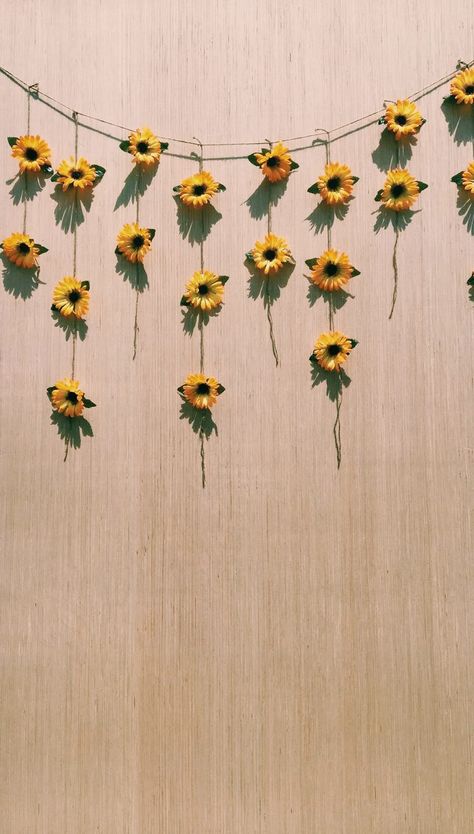 sunflower backdrop!   what you need//  1. fake sunflowers (buy full size flowers from dollar store and cut stems)  2. twine  3. large piece of plywood 4. hot glue   instructions//  1. measure top string to the size of your plywood 2. cut two different length strings  3. glue two flowers on shorter strings and glue three flowers on longer strings  4. tie strings with sunflowers on top string 5. place on your plywood Yellow Room Decor, Sunflower Room, Summer Room Decor, Yellow Room, Sunflower Wallpaper, Sunflower Decor, Trendy Flowers, Trendy Wallpaper, Yellow Aesthetic