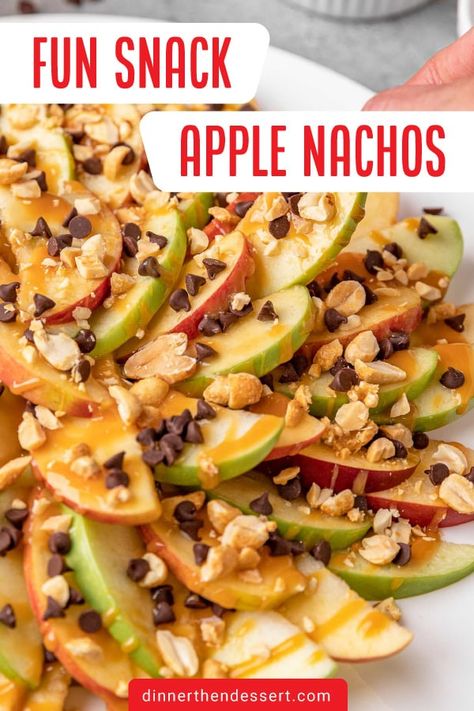 Easy Apple Nachos are a fun snack or party treat of apple slices with caramel drizzle, chocolate chips, and peanuts. Plus more topping ideas! Sliced Apples With Caramel, Carmel Apple Slice Tray, Apple Slices With Caramel, Turtle Apple Slices, Chocolate Apple Slices, Apple Nachos Recipe, Slow Cooker Appetizers, Apple Nachos, Caramel Drizzle