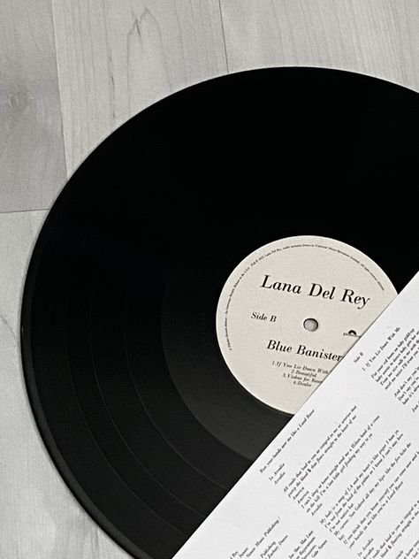 lana del rey vinyl aesthetic blue banisters lyrics Blue Banisters Aesthetic Lana, Black Coqquete Aesthetic, Lana Del Ray Blue Banister, Lana Del Rey Vinyl Wallpaper, Lana Vinyl Aesthetic, Lana Del Ray Widgets, Lana Del Rey Aesthetic Widget, Lana Del Rey Black Aesthetic, Blue Lana Del Rey Aesthetic