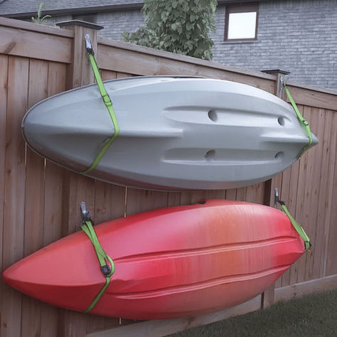 Here's a cool idea to store a kayak using straps. Storing Kayaks Outside, Kayak Wall Mount, Kayak Wall Storage, Kayak Garage Storage, Kayak Rack Diy, Kayak Storage Ideas, Diy Kayak Storage, Sup Storage, Kayak Storage Garage