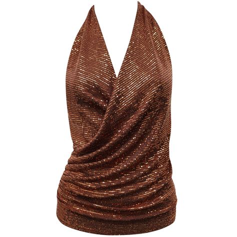 A sexy and elegant choice in this copper sequin halter neck top. Team with smart trousers for an effortless and classy evening look.  All styles are made in the UK and are limited edition. Hand Wash Recommended 92% Nylon 5% Spandex 3% Metal Halter Neck Tops, Stretch Sequin Halter Neck Top, Brown Halter Top, Sequined Fitted Halter Neck Top, Brown Stretch Halter Neck Crop Top, Fitted Brown Halter Top For Festivals, Fitted Brown Halter Neck Crop Top, Sequin Halter, Halter Neck Top