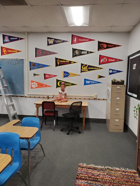 We have a lot of college pennants, so I chose to decorate the back wall with them. #avid #classroomideas #pennants College Pennants, Classroom Idea, Cal Bears, Washington Huskies, Arizona State, School Counselor, Counseling, Standing Desk, The Back