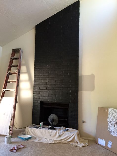 Satin black paint enlivens this brick fireplace!! Painted Fireplace Brick Black, Black Brick Chimney, Charcoal Painted Brick Fireplace, Black Chimney Fireplaces Painted Bricks, Black Chimney Fireplaces, Black Tall Brick Fireplace, Painting Brick Fireplace Black, Paint Fireplace Tile Black, Black Fireplaces