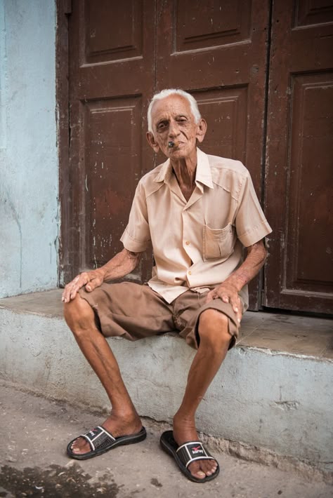 man in beige button-up shirt sitting in front of brown door Photo Of People, Life Drawing Reference, Human Figure Sketches, Human Body Parts, Indian People, India Photography, People Figures, Figure Reference, India People