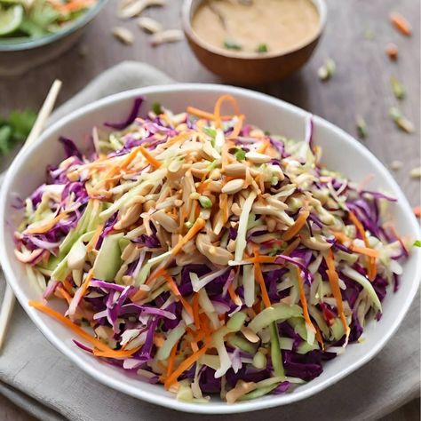 Asian Slaw with Peanut Dressing - Whether you're hosting a summer BBQ or looking for a refreshing side dish to complement your plant-based feast, this Asian Slaw will surely steal the show! What elevates this slaw to new heights is my special peanut dressing, boasting a perfect balance of sweet maple syrup, tangy rice vinegar, creamy peanut butter, and a kick of sriracha for that extra spicy punch! Thai Peanut Slaw Salad, Spicy Asian Slaw Recipe, Peanut Butter Coleslaw, Thai Slaw With Peanut Dressing, Asian Coleslaw Dressing, Peanut Slaw, Salad Sides, Asian Slaw Recipe, Broccoli Slaw Salad