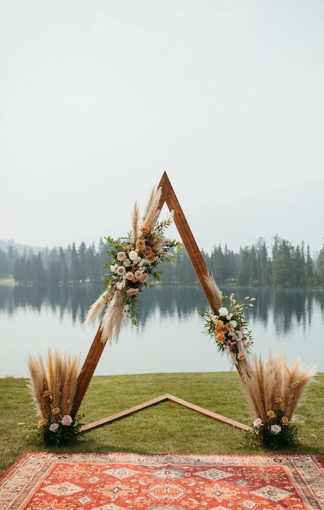 Earthy and Intimate Wedding in Jasper | Rocky Mountain Bride Jasper Park Lodge, Ceremony Arches, Jasper Park, Arbor Decor, Wyoming Weddings, Romantic Wedding Ceremony, Davids Bridal Bridesmaid Dresses, Indoor Wedding Ceremonies, Cabin Wedding