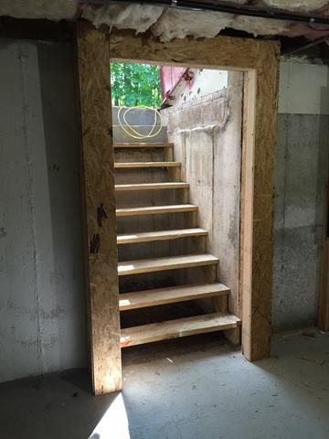 To prevent any drafts or unwanted pests in the basement, the team installed a new door frame and insulated the perimeter with Spray Foam. Basement Door, Basement Foundation, Basement Doors, Basement Entrance, Door Makeover Diy, Old Greenwich, Basement Reno, Root Cellar, Storm Shelter