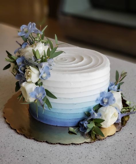 Soft blue ombre with fresh flowers to match 💙  #floralcake #weddingcake #cakedecorating #ombrecake #blueombre #weddingcakes… Blue Cake Decorating Ideas, Wedding Cake With Blue Accents, White And Blue Engagement Cake, Small One Tier Wedding Cake, Simple Blue Wedding Cake, 2 Tier Wedding Cakes Simple Elegant Blue, Small Blue Wedding Cake, Engagement Cake Blue, Blue Boho Cake