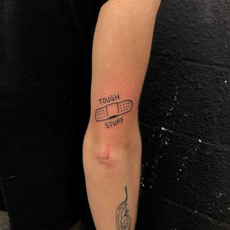 Words ‘Tough stuff’ and a band-aid tattoo by tattooist yeahdope Band Aid Tattoo, Upper Leg Tattoos, Tattoos Leg, Meaningful Tattoo Quotes, Cool Arm Tattoos, Tiny Tattoo, Tattoo Design Book, Leg Tattoo, Tattoo Models