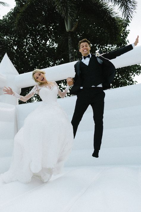 This Couple Had a Giant Bouncy Castle at Their Wedding, and the Photos Are SO Fun! Aesthetic Wedding Ceremony, Unique Wedding Ceremony Ideas, Unique Wedding Ceremony, Unity Ceremony, Sand Ceremony, Aesthetic Wedding, Bouncy Castle, Wedding Ceremony Ideas, Jumping For Joy