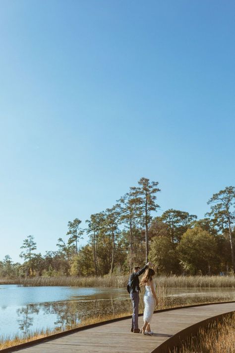 Engagement Photos on a Lake in Houston | Houston Photographer | This couple chose to take their engagement photos overlooking a lake. We walked around through the trees at sunset and they popped some champagne to celebrate! Discover Houston engagement photoshoot, Houston engagement shoot, Houston lake engagement photos, and golden hour engagement photos. Book Bianka to capture your Houston engagement pictures at biankasphotography.com Houston Engagement Photoshoot, Houston Picture Locations, Houston Senior Picture Locations, Houston Portrait Locations, Houston Engagement Photo Locations, Engagement Photos Houston, Lake Engagement Photos, Usa Trip, Lake Engagement