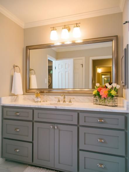 The new sink and vanity in the bathroom of the master suite in the McKenzie home, as seen on Fixer Upper. (after) Küchen In U Form, Baylor Football, Grey Bathroom Cabinets, 80s Era, Gray Cabinets, Inviting Home, Bathroom Redo, Trendy Bathroom, Grey Cabinets