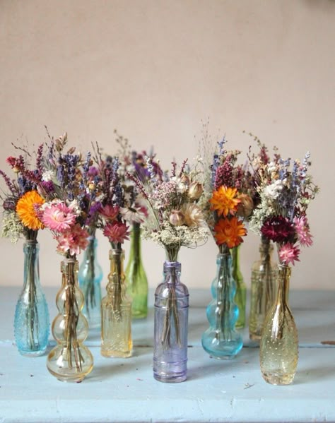 Dried Flowers In Bottles Wedding, Glass Jar With Flower, Vintage Glass Vases Wedding, Thrifted Glass Wedding, Dried Colorful Flowers, Wedding Theme Ideas Vintage, Dried Floral Decor Wedding, Glass Bottle Flowers, Glass Bottles With Flowers