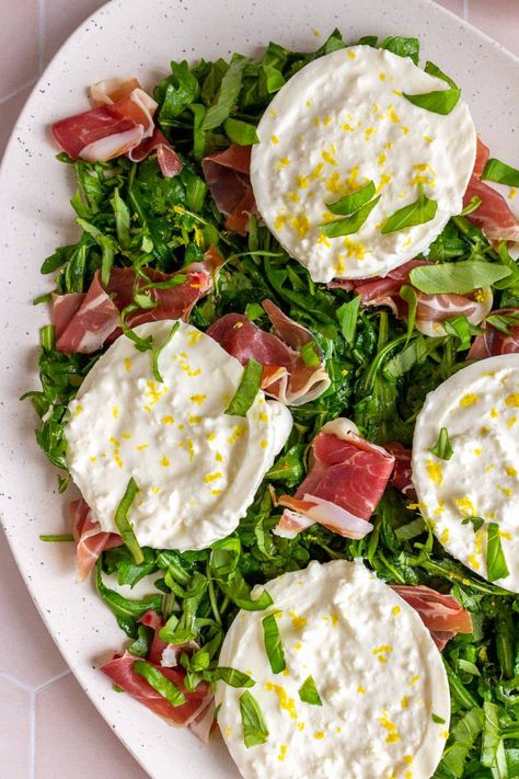 Ready in a few minutes, this prosciutto and burrata arugula salad is perfect for entertaining! It's such an easy appetizer to throw together, and it looks absolutely stunning. The creamy burrata paired with the peppery arugula and salty prosciutto makes for such a delightful bite.