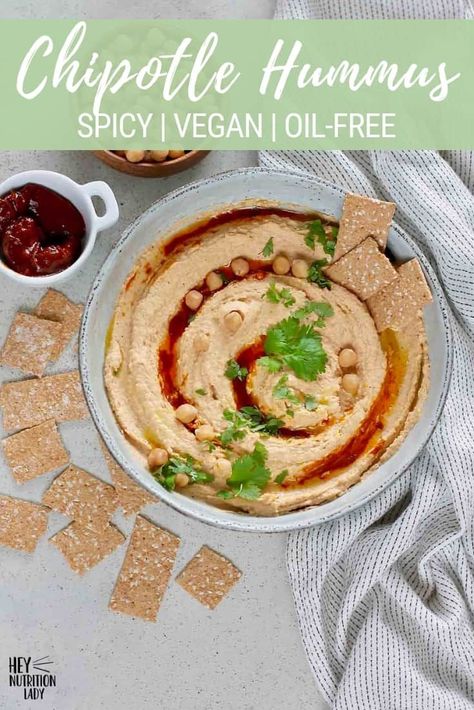 This Chipotle Hummus is the spicy hummus recipe you've been waiting for! Perfect for healthy snacks, dips, veggies, sandwiches, and wraps, this vegan hummus recipe made with tahini, garlic, and spicy chipotle peppers. A few minutes in your food processor is all it takes to mix this oil free hummus together! #hummus #chipotlehummus #spicyhummus #veganhummus #oilfreehummus #healthyhummusrecipe #vegan #heynutritionlady Chipotle Hummus Recipe, Oil Free Hummus Recipe, Oil Free Hummus, Vegan Hummus Recipe, Spicy Hummus Recipe, Chipotle Hummus, Healthy Hummus Recipe, Spicy Hummus, Hummus Recipe Homemade