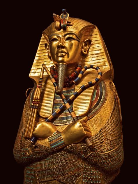 This coffin of solid gold is covered with incised decorations and inscriptions inside and outside, with the names and epitaph of the deceased king and protective texts. It is inlaid with semiprecious stones and colored glass. The coffin’s shape is that of Osiris holding the sacred insignia, the heka scepter and the flail. The vulture and the uraeus, or rearing cobra, protect his forehead. The divine beard is made of gold inlaid with blue glass. Deities of Upper and Lower Egypt protect. King Tut Tomb, The Boy King, Cave Of Wonders, King Tutankhamun, Ancient Egyptian Civilization, Egypt Museum, Amenhotep Iii, Egyptian Civilization, Egypt Ancient