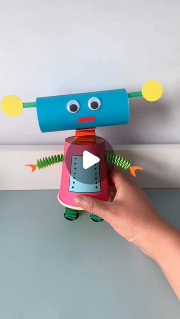 paper crafts creator on Instagram: "let's use paper cups and cardboard to make fun cartoon robots. children love it very much and spend most of the day playing with it.  #kindergartenhandmade #parentchildcraft #homemadetoys #papercuprobot #robotcraft #funwithkids #creativecraft #diytoys #handmadefun #cardboardcraft" Robot Puppet Craft, Paper Robot, Cardboard Robot, Make A Robot, Robot Craft, Puppet Crafts, Kids Crafting, Homemade Toys, Paper Cups