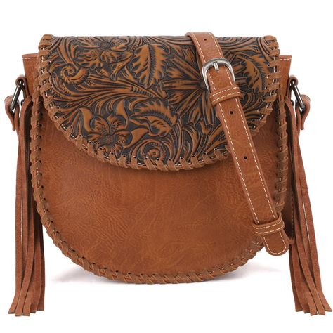 PRICES MAY VARY. Inspired by the classic Acanthus, a symbol of life and vitality in ancient Greece, our crossbody bag is the designer's creation. Leather tassel on both sides and whipstitch details give a rebellious touch to this western purse's slouchy look. Top zipper closure. Magnetic button closure flap.Adjustable crossbody strap. The inside of the bag includes a zippered pocket and 2 open pockets.Size: 8.5" x 3.5" x 8.5" (Drop 24") Montana West combines the best of traditional western eleme Western Bags Purses, Saddle Purse, Montana West Purse, Western Bag, Western Purses, Western Saddle, Crossbody Bags For Women, Western Leather, Leather Flowers