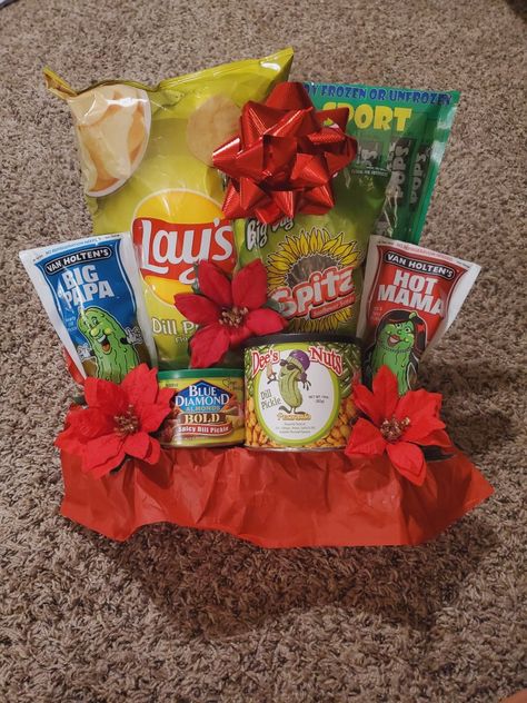 My cousin absolutely loves pickles. So this Christmas I put together a pickle flavored snacks gift basket! It was super fun to make because of all the different items I was able to find. Best part was that it was also inexpensive. Items include Popsicles, chips, nuts and of course...Pickles! All with pickle flavor! Will be placing in a bag with a bow and garnish with a pickle ornament. Pickle Basket Gift, Pickle Gifts Ideas, Pickle Gift Basket, Dance Competition Gifts, Competition Gifts, Snack Gift Baskets, Family Gift Baskets, Pickle Gifts, Pickle Ornament