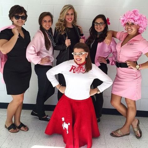 We love this Pink Ladies costume idea from Grease! It's ideal for a hen party as everyone can dress as a different character or all as the Pink Ladies. Would you choose preppy Sandy or sexy Sandy? Grease outfit ideas are one of the best hen themes - but you can find loads more at Hitched! Grease Characters Costumes, Grease Group Halloween Costumes, Grease Group Costumes, Grease Halloween Costumes Group, Pink Lady Hairstyles Grease, 50s Sock Hop Outfit, Grease Outfits Ideas, Grease Inspired Outfits, Grease Costumes Diy