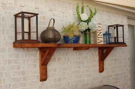 [d]Patio shelves are a great way to make your patio feel more like an outdoor room.  I had the perfect blank wall above my grill.[/d][d]I opted for a single 8 f… Wall Shelving Ideas, Brick Wall Decor, Patio Wall Decor, Outdoor Shelves, Diy Porch Swing, Cedar Walls, Diy Hanging Planter, Wall Shelving, Rustic Porch