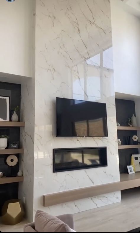 Modern Firewall Design, Fireplace Ideas Luxury, Marble Entertainment Wall, Marble Floor To Ceiling Fireplace, Quartz Tile Fireplace, Open To Above Living Room Fireplaces, Marble Wall Fireplace Living Rooms, Tall Fireplace Ideas Modern, White Quartz Fireplace Wall