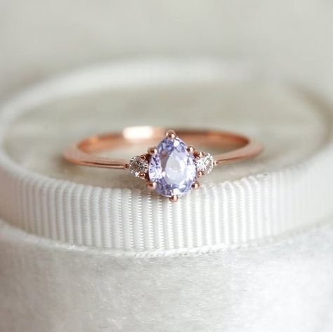 Elizabeth Taylor said it best when she said that: “Jewelry has the power to be that one little thing that makes you feel unique.” ✨  We are more than glad to be making women all over the world feel unique and enhancing their beauty with our pieces, just like this Liz ring featuring lavender sapphire and white diamonds 💖  If you would like something made specially for you, please contact us at info@capucinne.com ✨ Purple Engagement Ring, Purple Engagement Rings, Lavender Ring, Lavender Sapphire, Simple Diamond Ring, Ring Purple, Pear Ring, Unique Diamond Rings, Purple Sapphire