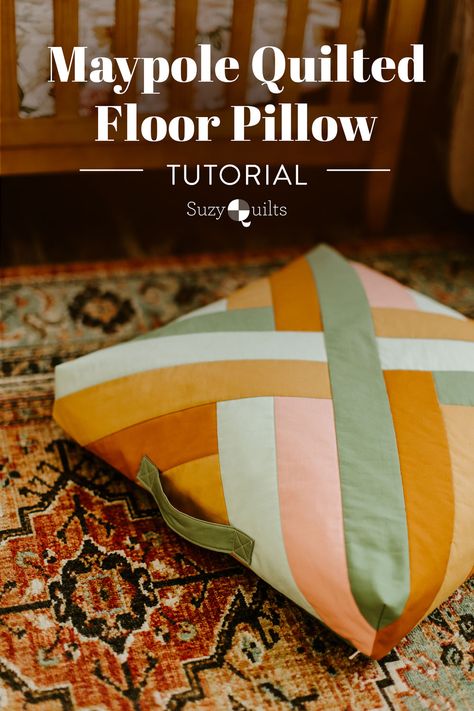 This quilted floor pillow tutorial walks you through step-by-step instructions to sew a floor pillow using the Maypole wall hanging pattern. suzyquilts.com #sewingtutorial #quiltpattern Backrest Pillow Sewing Pattern, Quilt Block Pillow, Sewing Wall Art, House Sewing Projects, Pillow Crafts Diy, Scrap Fabric Projects Easy No Sew, Pillow Quilt Pattern, Throw Pillow Sewing Patterns, Sewing Projects Blankets