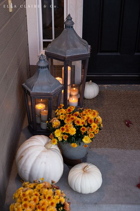 A timeless and welcoming fall porch decorated with lanterns, mums, pumpkins, and plaid with rustic vintage accents Fall Container Plants, Outside Fall Decorations, Fall Front Porch Decor Ideas, Outside Fall Decor, Fall Containers, Fall Front Porch Decor, Fall Decor Ideas, Fall Thanksgiving Decor, Autumn Decorating