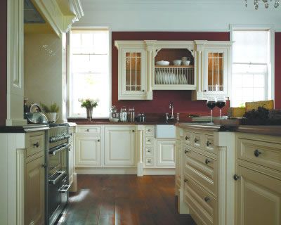 THis is what I dream of-- cranberry painted walls and CREAM, not white, cabinets...but with different hardware. Red Kitchen Walls, Burgundy Walls, Antique White Kitchen, Kitchen Wall Shelves, Kitchen Wall Colors, Cabinets And Countertops, Red Kitchen, Red Walls, Kitchen Paint