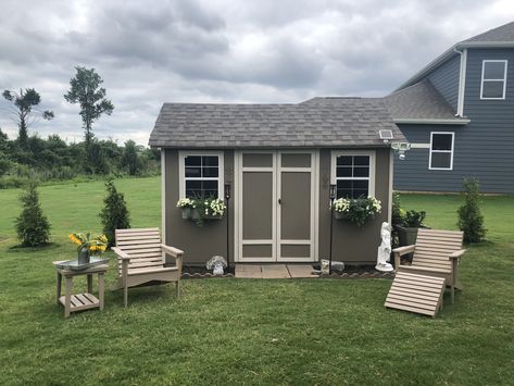 Love the features I created The window boxes The galvanized bench and flowers pots with lots of flowers. And of course the requisite windmill decor. Such an inviting shed almost makes gardening chores fun! Front Of Shed Landscaping, Landscaping Around Storage Shed, Landscape Around A Shed, Flower Garden Around Shed, Shed Made Of Windows, Garden Sheds Made From Old Storm Windows, Small Barn Ideas, Shed Landscaping, Diy Awning