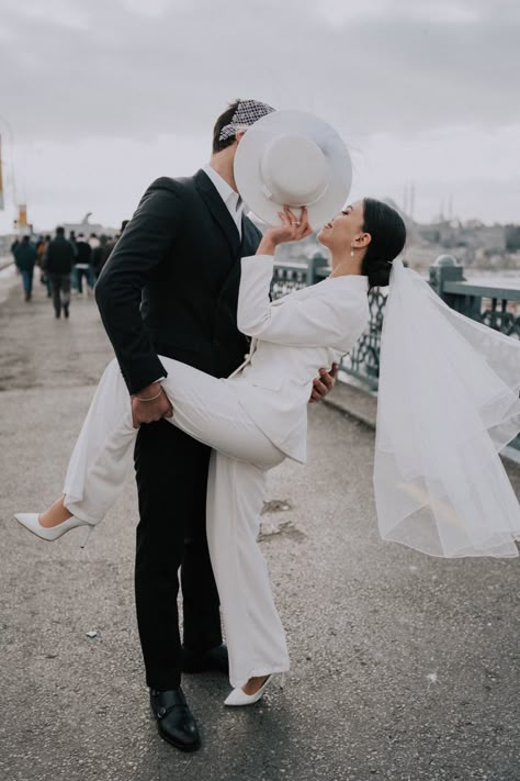 Bride in white suit and veil Suit And Veil Bride, Female Wedding Suit, Veil Hair Down, Wedding Suit Women, Wedding Suits For Bride, Pre Wedding Photoshoot Theme, White Wedding Suit, Bride Suit, Wedding Photo Studio