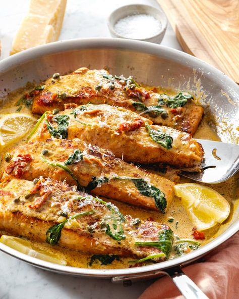 Elevate your dinner game with our Creamy Tuscan Salmon, a contender for the best salmon recipe you've ever tried! Ready in just 30 minutes, it promises to wow your guests with its rich flavors and elegant presentation. #salmon #dinnerrecipe #comfortfoodrecipes The Best Salmon Recipe Ever, Best Ever Salmon Recipe, Creamy Tuscan Salmon, Baked Mahi Mahi, Tuscan Salmon Recipe, Tuscan Salmon, Best Salmon Recipe, Best Salmon, A Couple Cooks