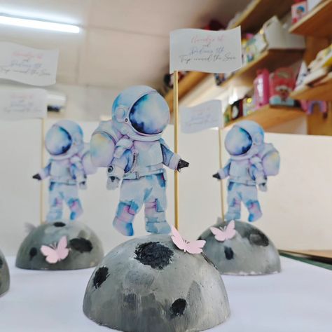 Space inspired centerpieces decor . . . . #handcrafted #handmade #crafts #custommade #solarsystem #astronaut #astronauttheme #kidspartyideas #decor #eventdecor #paprtyprops #eventstyling #tabledecor #kidsbirthday Astronaut Birthday Theme Diy, Rocketship Centerpiece Ideas, Two The Moon Themed Birthday Party, Astronaut Table Centerpiece, Astronaut Theme Centerpiece, Space Themed Birthday Party Decoration Diy, Solar System Centerpiece, Space Themed Table Centerpieces, Astronaut Centerpiece Space Party