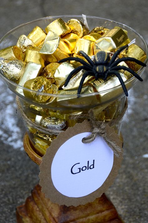 Indiana Jones: Party food. Gold foil wrapped candies. Also used in party favors. Ancient Egypt Party Food, Indian Jones Party, Archeology Theme Party, Indiana Jones Birthday Party Decor, Indiana Jones Party Decorations, Indiana Jones Theme Party, Egyptian Party Ideas, Egypt Birthday Party, Egypt Party