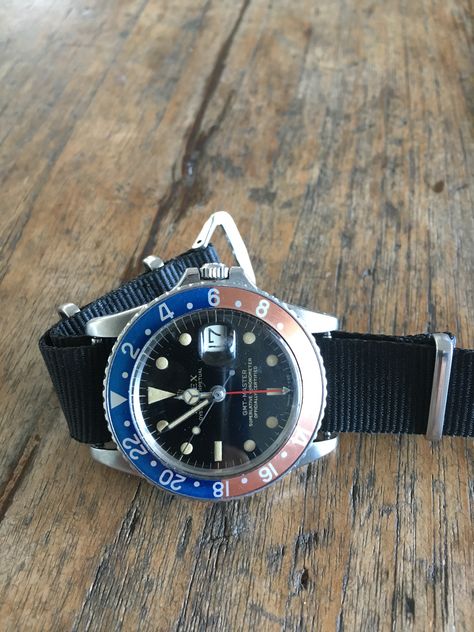 1965 Rolex GMT gloss dial gilt NATO strap. Rolex Explorer Nato Strap, Rolex Tudor, Rolex Explorer, Nato Strap, Dive Watches, Rolex Gmt, Rolex Watches, Watch Strap, Rolex