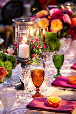 colorful wedding decor colored goblets orange green glasses etched wine glasses boho chic wedding Colored Goblets Wedding, Rainbow Glassware, Rainbow Wedding Decorations, Farm Table Wedding, Wedding Goblets, Colorful Centerpieces, Wedding Glassware, Wedding Tableware, Wedding Reception Seating