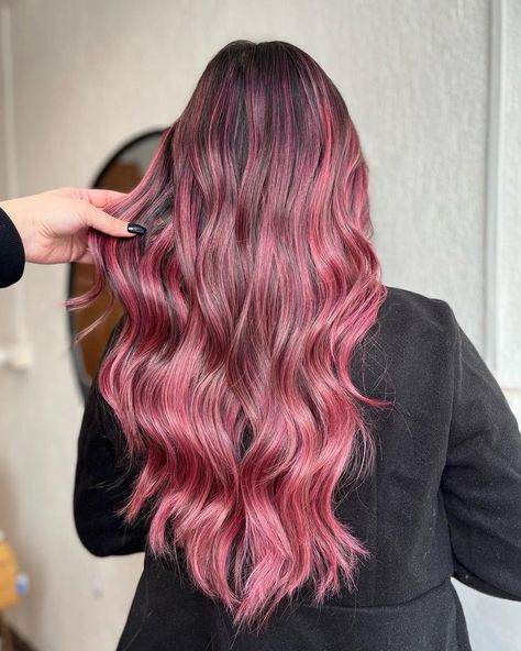 Bold and vibrant, this style showcases bright tones fading seamlessly into your natural hair color. It's a head-turner, perfect for those who love to stand out, making it a go-to for festive events or lively weekends. / Photo Credit: Instagram @karenchavarriar Pastel Pink Ombre, Balayage Styles, Pink Balayage, Raspberry Ripple, Vibrant Hair, Natural Blush, Pink Highlights, Hair Trend, Pink Tone