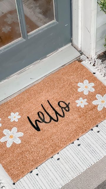 Nikki Muhilly | Realtor ® on Instagram: "The weather isn’t cooperating but that’s not stopping me from bringing some spring decor to the porch. @nickeldesigns has did it again with their custom doormat and layering rug! I’m obsessed with the daisies on this doormat. I love layering my doormats with rugs and @nickeldesigns has such a great variety! They even take custom orders! You can use code HEYSPRING for 15% off! Are you doing a spring decor refresh? Tell me below! #gifted #nickeldesigns" Spring Doormat Diy, Spring Door Mat Ideas, Spring Doormat Ideas, Diy Mats Doormats, Doormat Painting, Doormat Aesthetic, Door Matts, Spring Door Mat, Spring Doormat