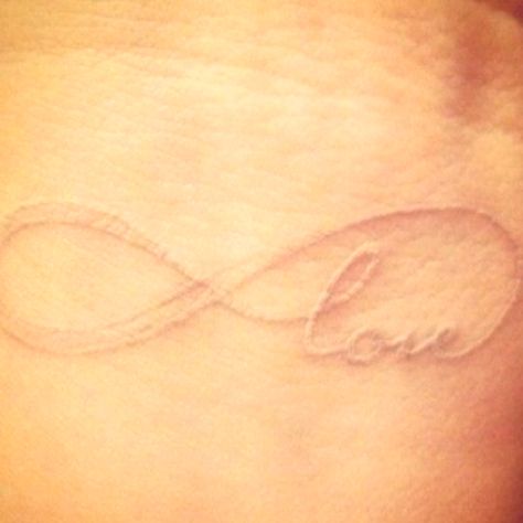 Nude colored tattoo Infinity Love Tattoo, Love Quote Tattoos, White Ink Tattoo, Omerta Tattoo, Love Tattoo, 1 Tattoo, Girly Tattoos, White Tattoo, Skin Art