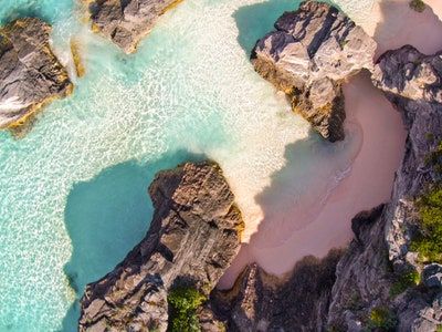 The Most Beautiful Pink Sand Beaches in the World | Condé Nast Traveler I Need Vitamin Sea, Pink Sand Beach, Horseshoe Bay, Hidden Beach, Parasailing, Tropical Getaways, Conde Nast Traveler, Beaches In The World, Conde Nast