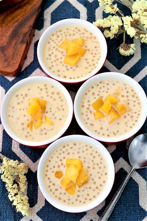 Learn to make this simple yet delicious Mango Sago dessert that is restaurant-worthy. Full of mango and coconut goodness studded with yummy sago pearls. | www.foxyfolksy.com #asian #dessert #tapioca #sago #mango #vegan #coconut milk #yummy Asian Tapioca Dessert Coconut Milk, Mango Coconut Sago, Mango Sago Dessert, Coconut Sago, Sago Dessert, Sago Pearls, Sago Recipes, Mango Desserts, Mango Sago