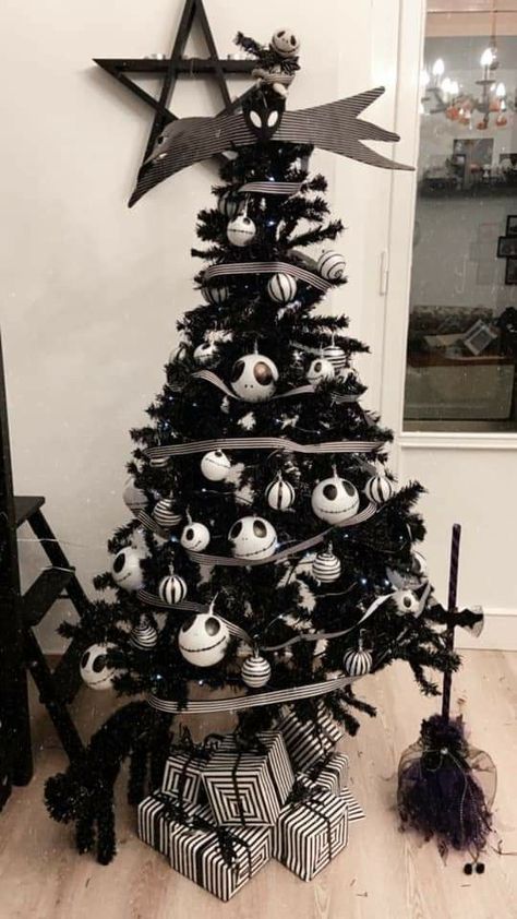 a black Halloween tree decorated with striped and Jack Skellington ornaments, striped ribbon and black brooms White Christmas Tree Halloween, Fake Christmas Tree Ideas, White Halloween Tree, Halloween Christmas Tree Ideas, Black Halloween Tree, Halloween Tree Decorations, Black Christmas Decorations, Nightmare Before Christmas Tree, Christmas Tree Decoration Ideas