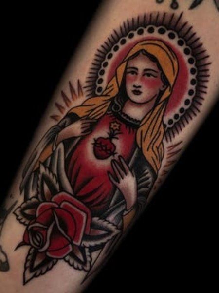 30 Incredible American Traditional Tattoo Designs - The Trend Spotter Tattoo American Traditional, Mother Mary Tattoos, Maria Tattoo, Traditional Tattoo Man, Catholic Tattoos, Virgin Mary Tattoo, Sacred Heart Tattoos, Traditional Tattoo Inspiration, Mary Tattoo