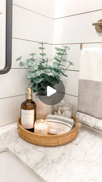 Cat Arcodia on Instagram: "Styling a small guest bathroom with affordable decor ✨   Tips: + a basket for texture  + tall greenery to hide outlets & add a pop of color + pretty hand towels  + jars to store items + a candle for a spa feel + don’t forget a pretty hand soap dispenser   Shop this post on the @liketoknow.it app or link in bio  •  •  •  •  •  #bathroomstyling #targetfinds #smallbathroom #amazonfinds #dailydecordose #ltkhome #guestbathroom #targetstyling #affordabledecor #stylereels #thepolishedjar #traystyling #hearthandhandwithmagnolia #brookemoraleshome #homedecorreels #bathroominspo #powderroom #traydecor #bathroomdecor #decoratingonabudget #affordablehomedecor #smmakelifebeautiful #bathroomstyle #targetstyle #modernfarmhousebathroom #copycatsstyle" Towel Basket Ideas, Hand Towel Basket, Hide Outlet, Outlets In Bathroom, Small Guest Bathroom, Hearth And Hand With Magnolia, Towel Basket, Bathroom Hand Towel, Tray Styling