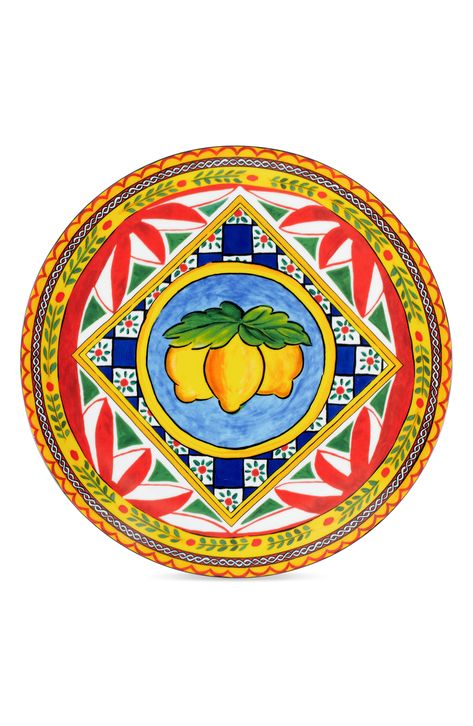 A pattern inspired by Sicilian folkloric traditions and landscapes illustrates this Italian-made porcelain charger plate to brighten your tablescapes. 12" diameter Porcelain Dishwasher safe Made in Italy Sicilian Decor, Italian Pattern, Color Me Mine, Chakra Art, Lemon Decor, Charger Plate, Italian Craftsmanship, Charger Plates, Italian Art