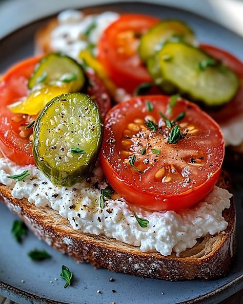 🍅 WOULD YOU ENJOY THIS FRESH 🍅 COTTAGE CHEESE TOMATO TOAST WITH HOMEMADE PICKLES 🍅 TODAY? 🍅 Elevate your lunch game with this Cottage Cheese and Tomato Bruschetta, perfectly paired with homemade pickles! It's light, nutritious, and bursting with fresh flavors. 🌿 A delicious and healthy lunch option that’s simple yet elegant, perfect for family or guests! 🌿 🍞 Ingredients 🍞 For the Toast: • 4 slices of good quality white bread • 2 tbsp olive oil For the Tomato Salad: • 2 cups cherry to... Cottage Cheese And Tomato Salad, Cottage Cheese And Tomato Toast, Cottage Cheese Tomato Toast, Tomato Cottage Cheese Toast, Cottage Cheese Cucumber Toast, Cucumber Tomato Cottage Cheese Salad, Cottage Cheese Toast Aesthetic, Sea Food Salad Recipes, Tomato Bruschetta