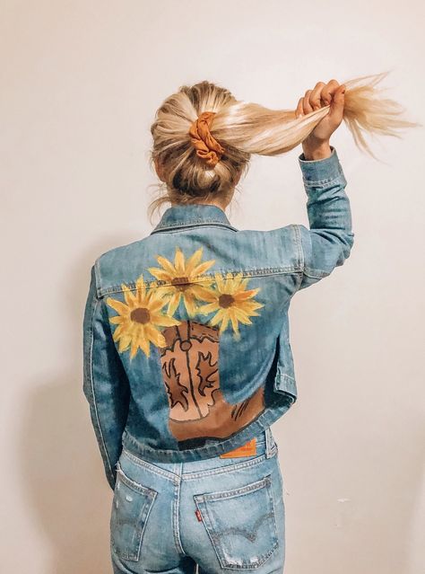 Cowboy boot and sunflowers painted onto an old denim jacket Hand Painted Jean Jacket Ideas, Sunflower Denim Jacket, Western Painted Denim Jacket, Hand Embroidered Jean Jacket, Painted Denim Jacket Ideas, Sunflower Things, Jean Jacket Painted, Western Jean Jacket, Jacket Painting