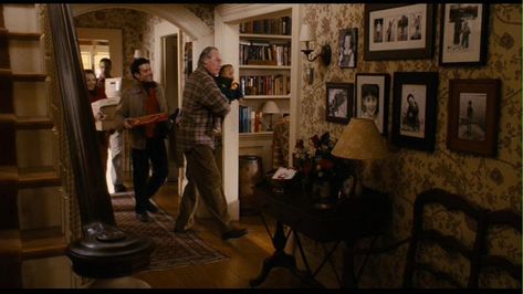 I love the warmth and nostalgia of this house. Love the wallpaper and off white baseboards and trim. Family Stone House, Hollywood Living Room, Stone Entryway, White Baseboards, Family Stone, New England Farmhouse, Romantic Comedies, Nora Ephron, The Family Stone